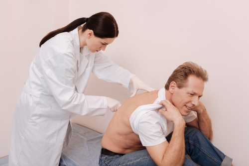 doctor checking for spinal stenosis